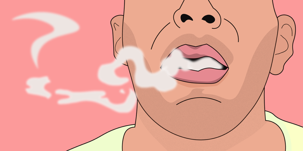 Man som blåser ut rök från e-cigarett